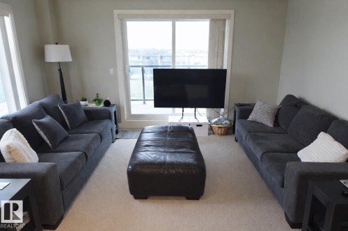 408 1230 Windermere Way, Edmonton, AB - Indoor Photo Showing Living Room