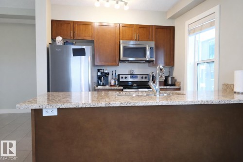 408 1230 Windermere Way, Edmonton, AB - Indoor Photo Showing Kitchen With Double Sink