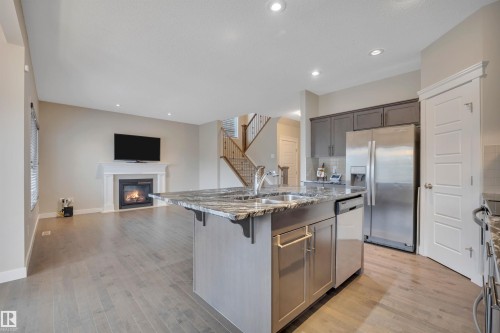 15807 18 Avenue, Edmonton, AB - Indoor Photo Showing Kitchen With Fireplace With Double Sink With Upgraded Kitchen
