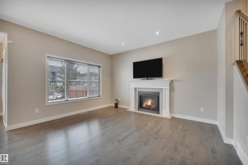 15807 18 Avenue, Edmonton, AB - Indoor Photo Showing Living Room With Fireplace