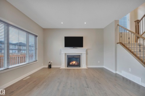 15807 18 Avenue, Edmonton, AB - Indoor Photo Showing Living Room With Fireplace