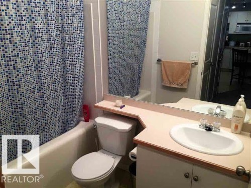 Bathroom with a bathtub, toilet, and vanity with a sink - 136 16221 95 Street, Edmonton, AB - Indoor Photo Showing Bathroom