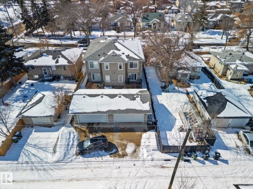 This property features a two-story residence with a light-colored exterior and a multi-level roof - 12913 124 Street, Edmonton, AB - Outdoor