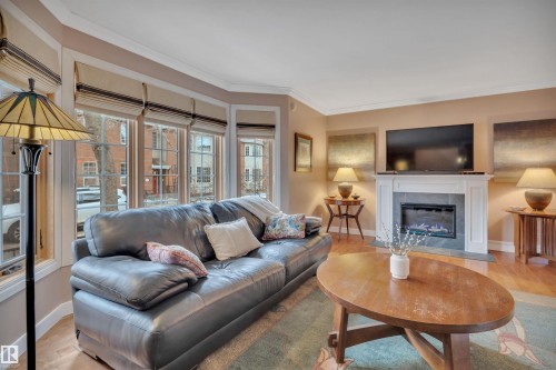 9727 101A Street, Edmonton, AB - Indoor Photo Showing Living Room With Fireplace