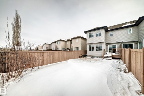 View from the back fence to the deck and rear of the home. - 1723 Hammond Crescent Nw, Edmonton, AB - Outdoor