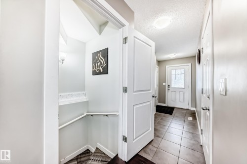 Shows the exit to the Recreation area, 3 piece bath, Extra bedroom, Family room and Utility area. - 1723 Hammond Crescent Nw, Edmonton, AB - Indoor Photo Showing Other Room