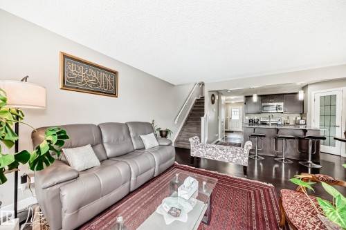 Overlooking the back area and the dinning area. - 1723 Hammond Crescent Nw, Edmonton, AB - Indoor Photo Showing Living Room
