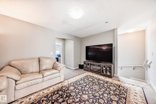 Upstairs bonus room appreciated by all families. - 1723 Hammond Crescent Nw, Edmonton, AB - Indoor Photo Showing Living Room