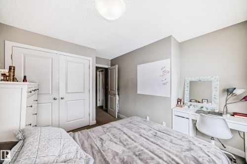 One of 4 bedrooms. This one is located on the second floor next to the bonus room. - 1723 Hammond Crescent Nw, Edmonton, AB - Indoor Photo Showing Bedroom