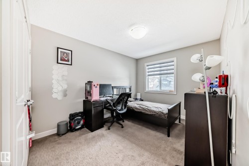 One of three bedrooms on the upper level. - 1723 Hammond Crescent Nw, Edmonton, AB - Indoor