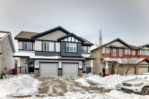 Driveway parking and street parking. - 1723 Hammond Crescent Nw, Edmonton, AB - Outdoor With Facade