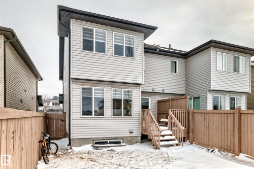 Fenced, landscaped and a deck with a privacy wall. - 1723 Hammond Crescent Nw, Edmonton, AB - Outdoor With Exterior
