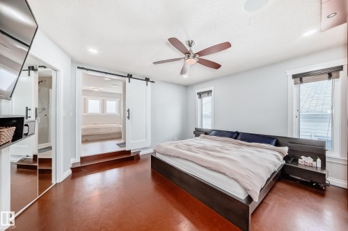 This room features rich, warm-toned flooring and light-colored walls - 3107 43 Avenue, Edmonton, AB - Indoor Photo Showing Bedroom