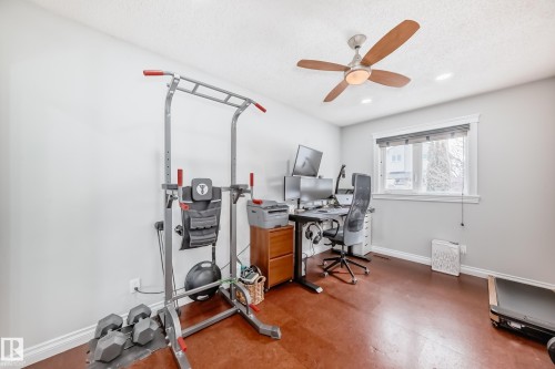 The room features light gray walls, a window with blinds, and recessed lighting in the ceiling - 3107 43 Avenue, Edmonton, AB - Indoor Photo Showing Office