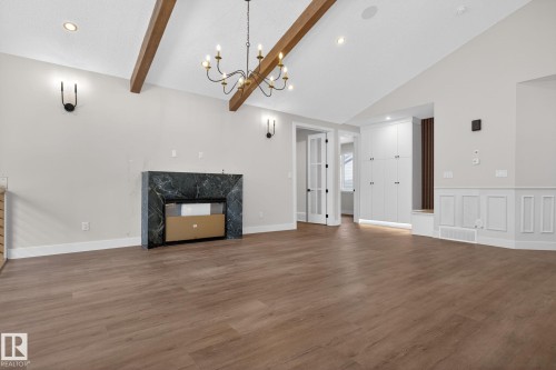 1129 Gyrfalcon Crescent, Edmonton, AB - Indoor Photo Showing Other Room With Fireplace