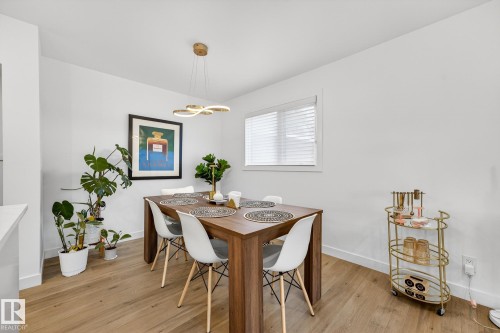 Dining room with baseboards and light wood-type flooring - 8604 142 Street, Edmonton, AB - Indoor Photo Showing Dining Room