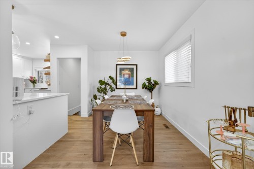 Dining area with light wood finished floors and recessed lighting - 8604 142 Street, Edmonton, AB - Indoor