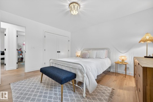 Bedroom featuring light wood-type flooring and a closet - 8604 142 Street, Edmonton, AB - Indoor Photo Showing Bedroom