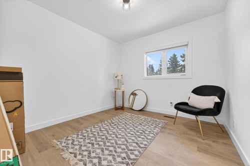 Sitting room with light wood finished floors - 8604 142 Street, Edmonton, AB - Indoor