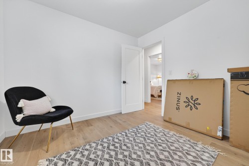 Sitting room featuring light wood-style flooring and baseboards - 8604 142 Street, Edmonton, AB - Indoor Photo Showing Bedroom