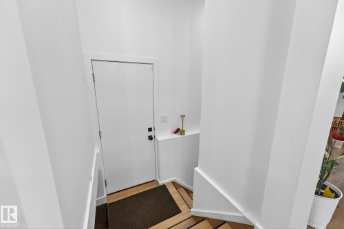Entryway featuring wood finished floors and baseboards - 8604 142 Street, Edmonton, AB - Indoor Photo Showing Other Room