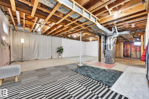 Unfinished below grade area with heating unit - 8604 142 Street, Edmonton, AB - Indoor Photo Showing Basement