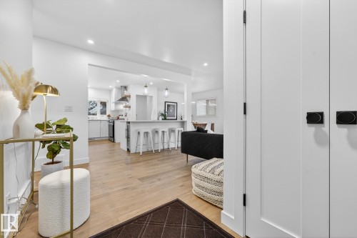 Hall with light wood-type flooring and recessed lighting - 8604 142 Street, Edmonton, AB - Indoor Photo Showing Other Room