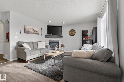 33 Hartwick Gate, Spruce Grove, AB - Indoor Photo Showing Living Room With Fireplace