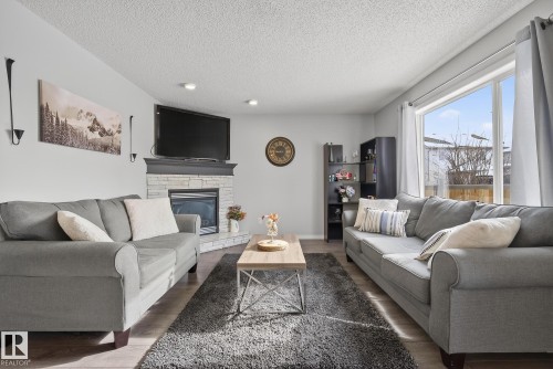 33 Hartwick Gate, Spruce Grove, AB - Indoor Photo Showing Living Room With Fireplace