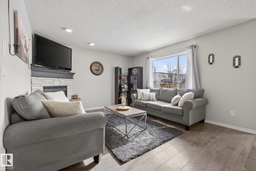 33 Hartwick Gate, Spruce Grove, AB - Indoor Photo Showing Living Room With Fireplace