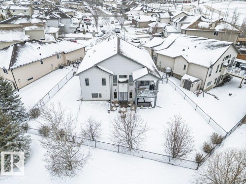 The property features a fenced yard, a two-story deck, and a shed - 33 Hillcrest Point(E), Fort Saskatchewan, AB - Outdoor