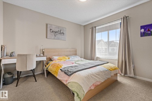 This room features light-colored walls and carpeting, creating a bright and inviting atmosphere - 165 603 Watt Boulevard, Edmonton, AB - Indoor Photo Showing Bedroom