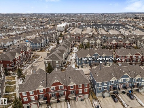 Aerial view of the property and its surrounding area, featuring a neighborhood with uniform housing styles - 165 603 Watt Boulevard, Edmonton, AB - Outdoor With View