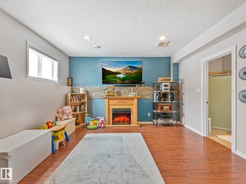 16412 61 Street, Edmonton, AB - Indoor Photo Showing Living Room With Fireplace