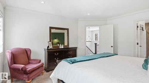 This room features light-colored walls, recessed lighting, and crown molding - 131 North Ridge Drive, St. Albert, AB - Indoor Photo Showing Bedroom