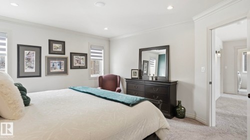 This room features light-colored walls and carpeted flooring - 131 North Ridge Drive, St. Albert, AB - Indoor Photo Showing Bedroom