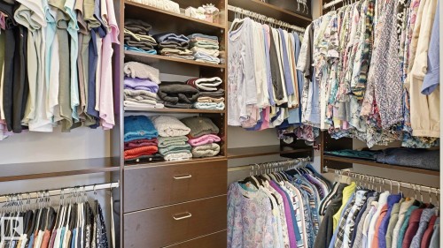 The property features a spacious closet with built-in shelving and hanging rods - 131 North Ridge Drive, St. Albert, AB - Indoor With Storage