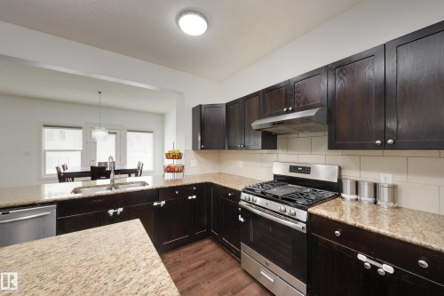 6131 10 Avenue, Edmonton, AB - Indoor Photo Showing Kitchen With Double Sink