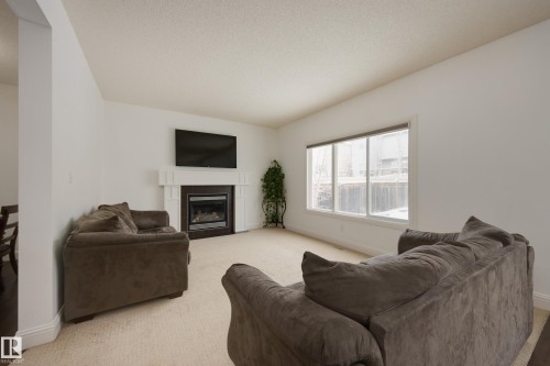 6131 10 Avenue, Edmonton, AB - Indoor Photo Showing Living Room With Fireplace