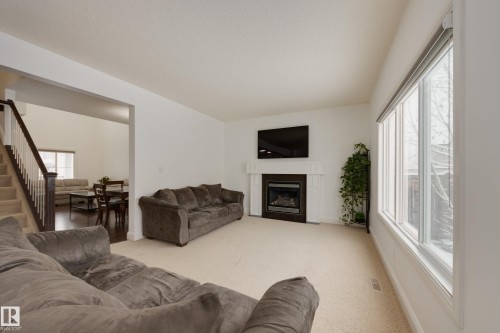 6131 10 Avenue, Edmonton, AB - Indoor Photo Showing Living Room With Fireplace