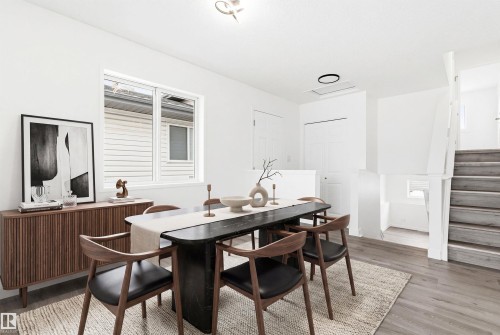 The dining area features light-toned flooring, a window, and white walls - 16223 55A Street, Edmonton, AB - Indoor