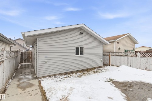 The property features a detached garage with light-colored siding and a window - 16223 55A Street, Edmonton, AB - Outdoor With Exterior