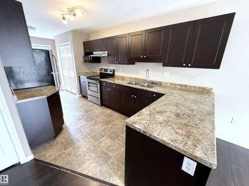 87 Haney Landing, Spruce Grove, AB - Indoor Photo Showing Kitchen With Double Sink
