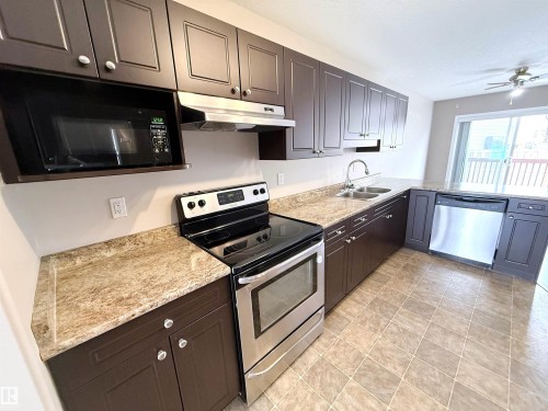 87 Haney Landing, Spruce Grove, AB - Indoor Photo Showing Kitchen With Double Sink