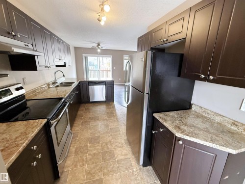 87 Haney Landing, Spruce Grove, AB - Indoor Photo Showing Kitchen With Double Sink