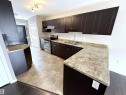 87 Haney Landing, Spruce Grove, AB  - Indoor Photo Showing Kitchen With Double Sink 