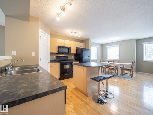 25 8304 11 Avenue, Edmonton, AB - Indoor Photo Showing Kitchen With Double Sink