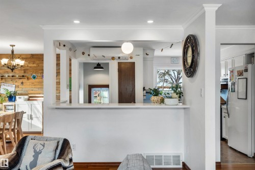 The property features hardwood floors, white trim, and recessed lighting - 4208 89 Street Nw, Edmonton, AB - Indoor