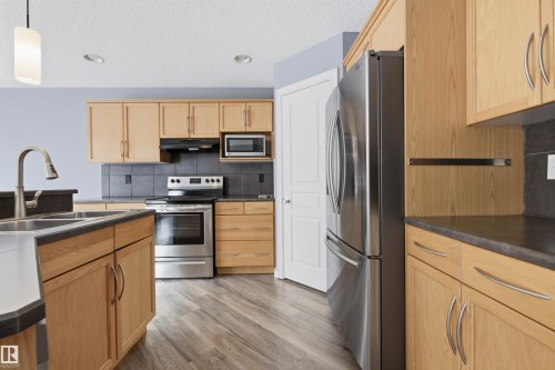 125 Rue Masson, Beaumont, AB - Indoor Photo Showing Kitchen With Double Sink