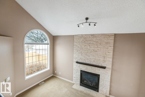 235 River Point(E), Edmonton, AB - Indoor Photo Showing Living Room With Fireplace